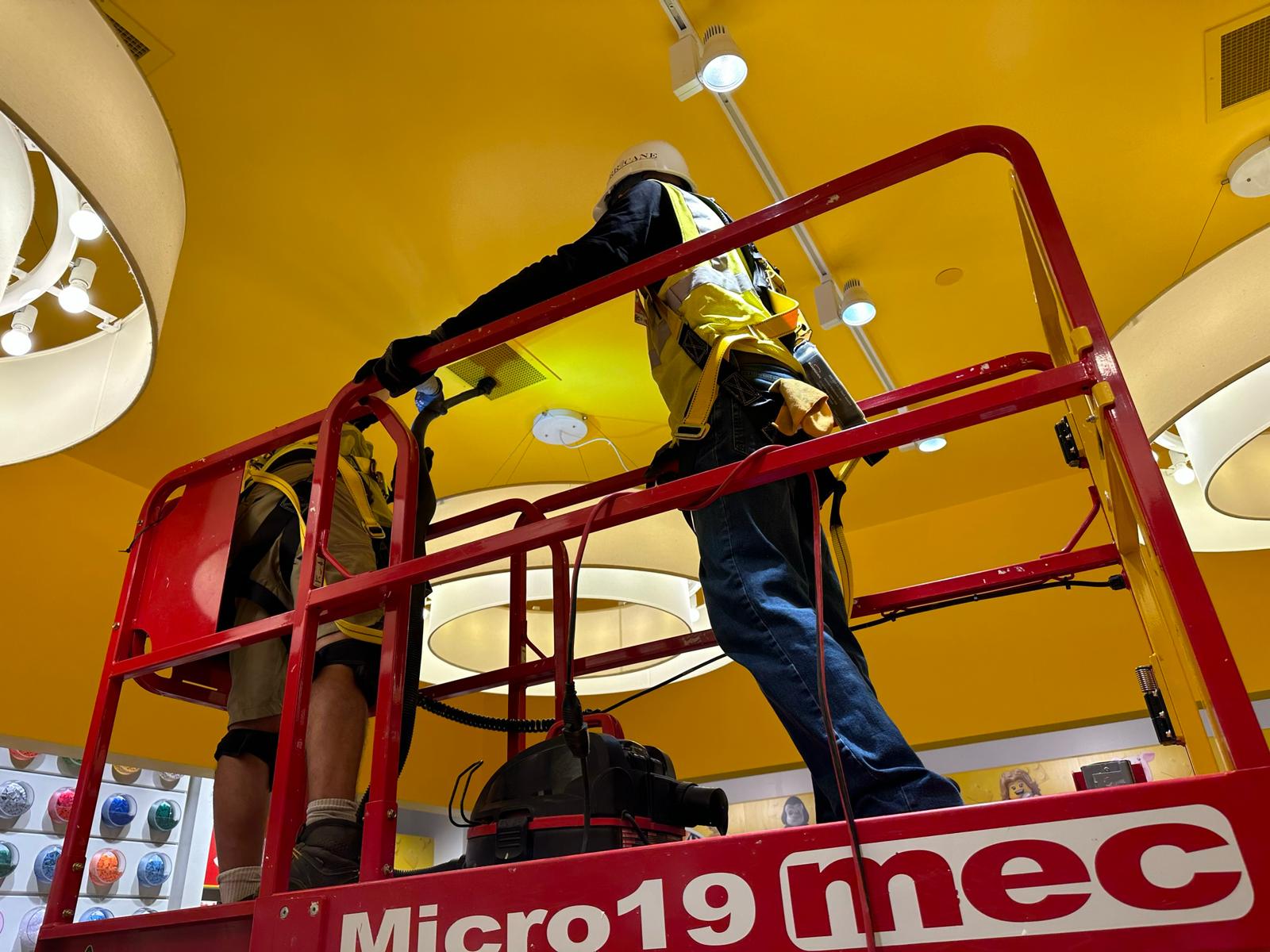 LEGO Store — diffuser cleaning from scissor lift